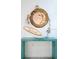 Stylish entryway table decorated with nautical theme decor and a round wood-framed mirror at 4311 123Rd W St, Cortez, FL 34215