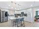 Bright kitchen with white cabinetry, stainless appliances, and a central island with seating at 4311 123Rd W St, Cortez, FL 34215