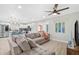 Open living space with modern decor, stylish furnishings, and a view of the kitchen at 4311 123Rd W St, Cortez, FL 34215