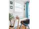 Close up of home office featuring an orange door, glass desk and coastal decorations at 4311 123Rd W St, Cortez, FL 34215