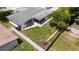 Aerial view showcasing fenced backyard, home layout, and screened-in patio at 3410 Allandale Dr, Holiday, FL 34691