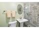 Bathroom featuring a modern vanity, sleek fixtures, and a glass-enclosed shower at 3410 Allandale Dr, Holiday, FL 34691