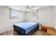 This simple bedroom offers lots of natural light and a ceiling fan at 3410 Allandale Dr, Holiday, FL 34691