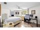 This cozy bedroom includes a workspace, and plenty of natural light at 3410 Allandale Dr, Holiday, FL 34691