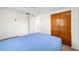 Bright bedroom featuring a ceiling fan and double closet with wooden doors at 3410 Allandale Dr, Holiday, FL 34691