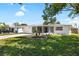 Charming home with a well-kept lawn, complete with landscaping, and a private driveway at 3410 Allandale Dr, Holiday, FL 34691