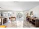 Bright living room featuring tile floors, sliding glass doors, and tasteful decor at 3410 Allandale Dr, Holiday, FL 34691