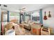 Bright sun room with ample natural light and an inviting seating area at 3410 Allandale Dr, Holiday, FL 34691