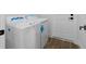 Laundry room features a modern washer and dryer set and access to a door at 10071 Kingsville Dr, Port Charlotte, FL 33981