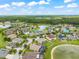 Stunning aerial view of a neighborhood dotted with homes, serene lakes, and lush greenery at 10720 Breaking Rocks Dr, Tampa, FL 33647