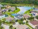 Expansive aerial shot of a community featuring beautiful homes and scenic ponds at 10720 Breaking Rocks Dr, Tampa, FL 33647