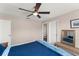 Spacious bedroom with en-suite bathroom, ceiling fan and a bench near the window at 10720 Breaking Rocks Dr, Tampa, FL 33647