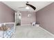 Spacious Bedroom with grey carpet, and two windows providing natural light at 10720 Breaking Rocks Dr, Tampa, FL 33647