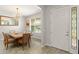 Formal dining room with a chandelier, large table, and elegant decor at 10720 Breaking Rocks Dr, Tampa, FL 33647