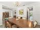 Spacious dining room with an elegant chandelier and views of the adjacent living areas at 10720 Breaking Rocks Dr, Tampa, FL 33647