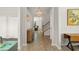 Bright foyer with tile flooring, staircase, and views into the living spaces at 10720 Breaking Rocks Dr, Tampa, FL 33647