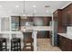 Modern kitchen featuring stainless steel appliances, white countertops, and dark cabinets at 10720 Breaking Rocks Dr, Tampa, FL 33647