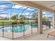 Inviting pool area featuring a sparkling pool, spa, scenic views, and lush landscaping, perfect for outdoor relaxation at 10720 Breaking Rocks Dr, Tampa, FL 33647