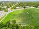 Aerial view features a large green soccer field at 1302 Georgetowne Cir, Sarasota, FL 34232