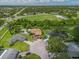 Aerial view showcases the house and yard with inviting pool at 1302 Georgetowne Cir, Sarasota, FL 34232