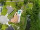 An overhead view shows a home featuring a pool and playground in the backyard at 1302 Georgetowne Cir, Sarasota, FL 34232