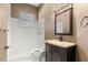 Bathroom featuring a single vanity and walk-in shower with white subway tile surround at 23109 Emerson Way, Land O Lakes, FL 34639