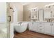 Luxurious bathroom featuring a glass shower, soaking tub, and double vanities at 23109 Emerson Way, Land O Lakes, FL 34639
