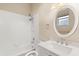 Cozy bathroom with a bathtub, shower, and single vanity at 23109 Emerson Way, Land O Lakes, FL 34639