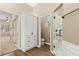 Bathroom includes a tiled shower, linen closet and separate water closet at 23109 Emerson Way, Land O Lakes, FL 34639