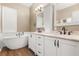 Beautiful bathroom with a soaking tub, double sinks, and modern fixtures at 23109 Emerson Way, Land O Lakes, FL 34639