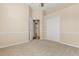 Bedroom featuring neutral carpet, a ceiling fan and a spacious closet at 23109 Emerson Way, Land O Lakes, FL 34639