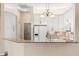 Kitchen with white cabinets, granite countertops, and stainless steel appliances at 23109 Emerson Way, Land O Lakes, FL 34639
