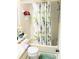 Clean bathroom featuring a shower with a floral curtain and vanity sink at 6640 121St Ave # 1, Largo, FL 33773