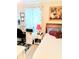 This bedroom has a bed, desk, nightstand and artwork hanging on the wall at 6640 121St Ave # 1, Largo, FL 33773