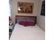 Cozy bedroom with a bed, side table, and decorative lion artwork on the wall at 6640 121St Ave # 1, Largo, FL 33773