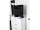 White dresser with a television and black media player in the corner of the bedroom at 6640 121St Ave # 1, Largo, FL 33773