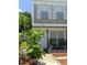 Charming two-story home featuring white shutters, a well-maintained lawn, and a meticulously landscaped yard at 6640 121St Ave # 1, Largo, FL 33773