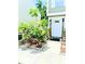 Well-maintained front yard with lush landscaping and charming walkway to the front door at 6640 121St Ave # 1, Largo, FL 33773