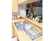 This kitchen has a double sink and a lovely wooden countertop at 6640 121St Ave # 1, Largo, FL 33773