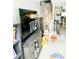 Comfortable living room featuring a TV and staircase at 6640 121St Ave # 1, Largo, FL 33773