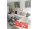 Comfortable living room with plush white sectional and glass coffee table at 6640 121St Ave # 1, Largo, FL 33773