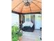 Relaxing outdoor patio area featuring a ceiling fan and comfortable seating at 6640 121St Ave # 1, Largo, FL 33773