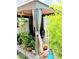 Cozy patio with lush greenery and a shaded seating area at 6640 121St Ave # 1, Largo, FL 33773