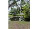 Picturesque view of a tranquil pond reflecting nearby trees and the surrounding neighborhood at 6640 121St Ave # 1, Largo, FL 33773