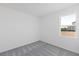 Comfortable bedroom features neutral carpet, white walls, and a bright window offering natural light at 9596 Vibrant Lane, Venice, FL 34292