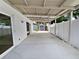 The backyard features a spacious covered patio, white fencing, and a shed at 10344 Rosemount Dr, Tampa, FL 33624