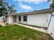 Charming single-story home with a well-maintained lawn, walkway, and lovely curb appeal under a bright blue sky at 10344 Rosemount Dr, Tampa, FL 33624
