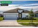 Charming single-story home with a well-maintained lawn and a two-car garage at 11126 Jenny Wren Rd, Weeki Wachee, FL 34614