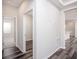 Hallway connecting main living areas with wood-look flooring at 11126 Jenny Wren Rd, Weeki Wachee, FL 34614