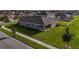 An aerial view of a single-story home showcasing the backyard, and surrounding neighborhood at 11818 Tetrafin Dr, Riverview, FL 33579